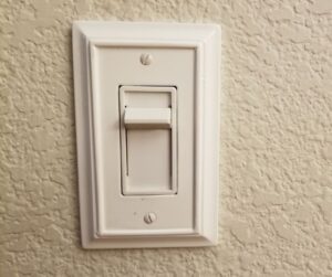 light dimmer switch on a white wall