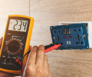 electrician testing an outlet