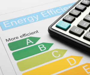 energy efficiency document with a calculator sitting on top 