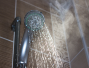 steaming water coming from shower head